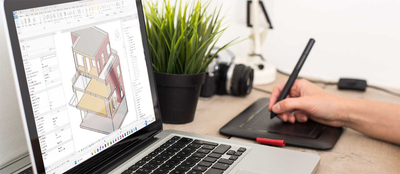Een student uit de graduaatsopleiding bouwkundig tekenen aan HOGENT werkt op een laptop in het softwareprogramma Autodesk Revit aan een bouwplan in 3D